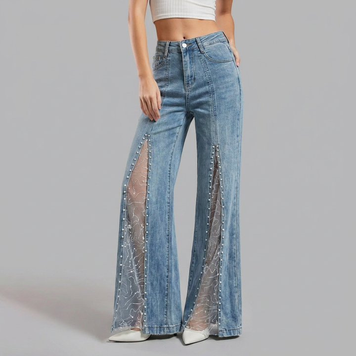 Jeans donna baggy vita alta con inserti in rete trasparente. Perfetto per un look casual chic e di tendenza.