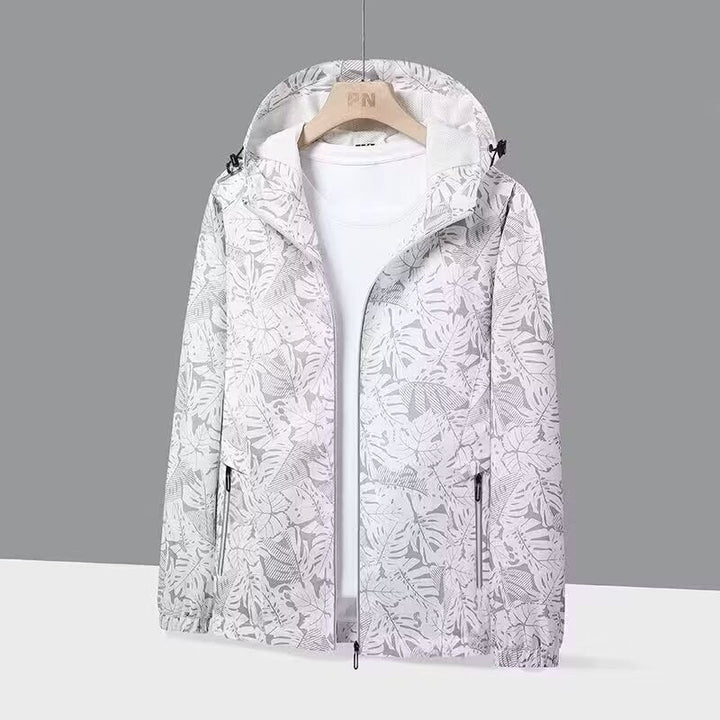 Giacca a vento da donna primaverile con stampa foglie, cappuccio. Ideale per look sportivi e passeggiate.