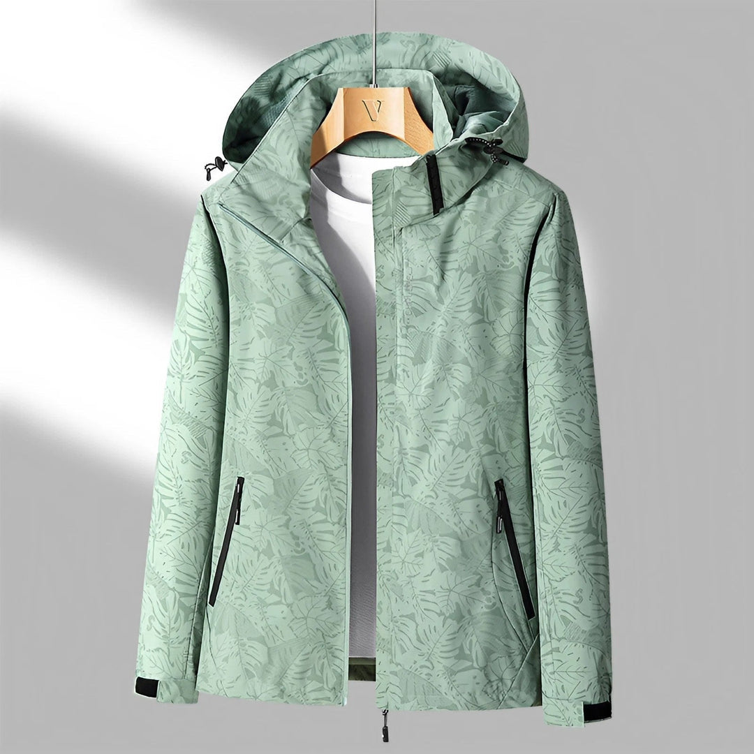 Giacca a vento donna, impermeabile con stampa foglie e cappuccio, ideale per giornate piovose e viaggi.