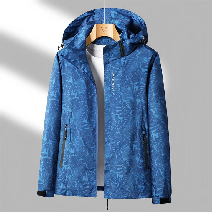 Leggera giacca donna impermeabile con cappuccio e stampa foglie, comfort e stile per l'esterno.