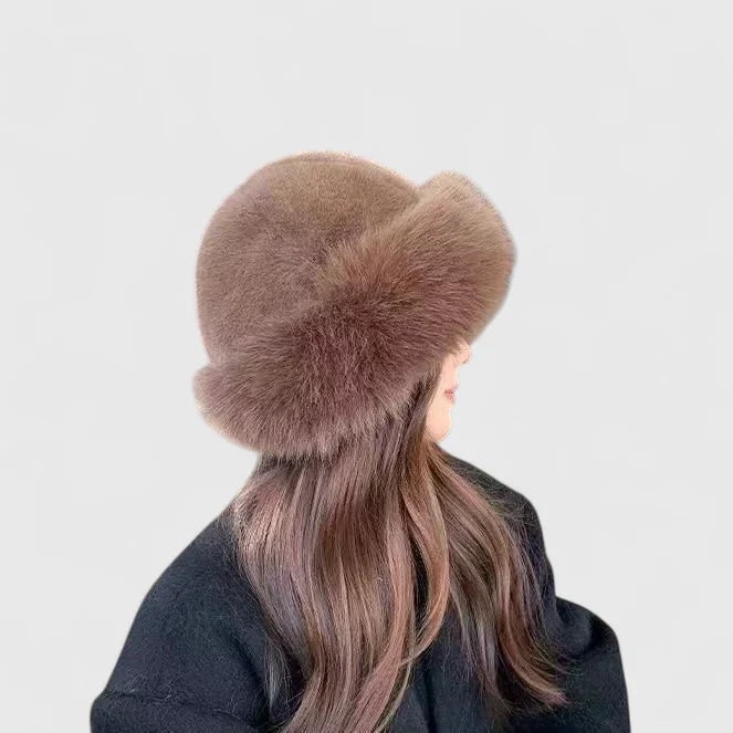 Morbido cappello invernale da donna in pelliccia sintetica, un accessorio caldo ed elegante con bordo per coprire le orecchie.