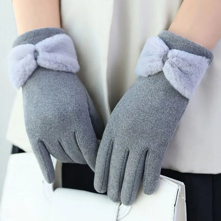 Guanti invernali donna in pile, caldi e touchscreen, con elegante fiocco in pelliccia sintetica per moda inverno.