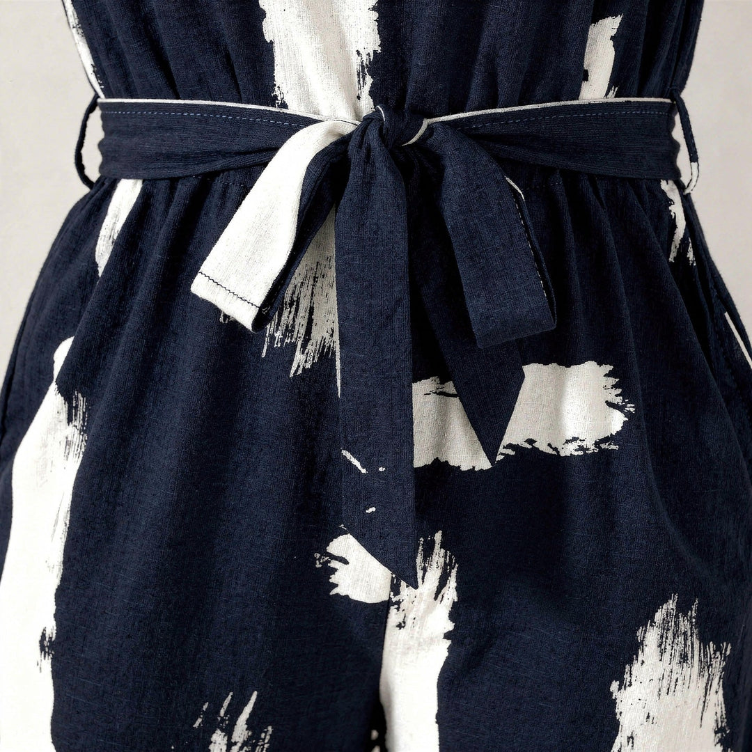 Elegante tuta donna blu navy. Jumpsuit estiva senza maniche, gamba larga per look casual o serali chic.