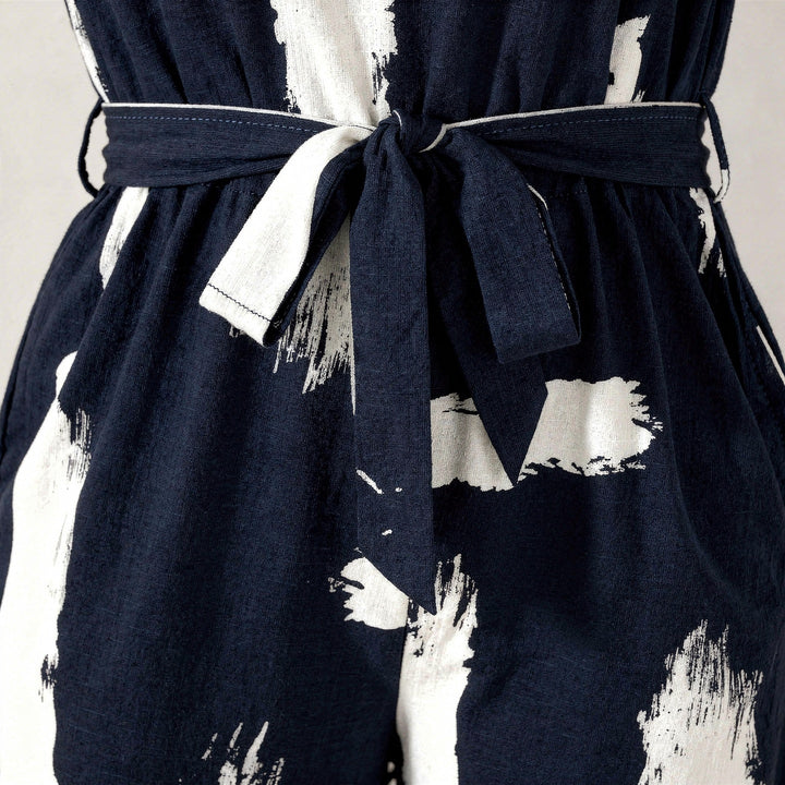 Elegante tuta donna blu navy. Jumpsuit estiva senza maniche, gamba larga per look casual o serali chic.