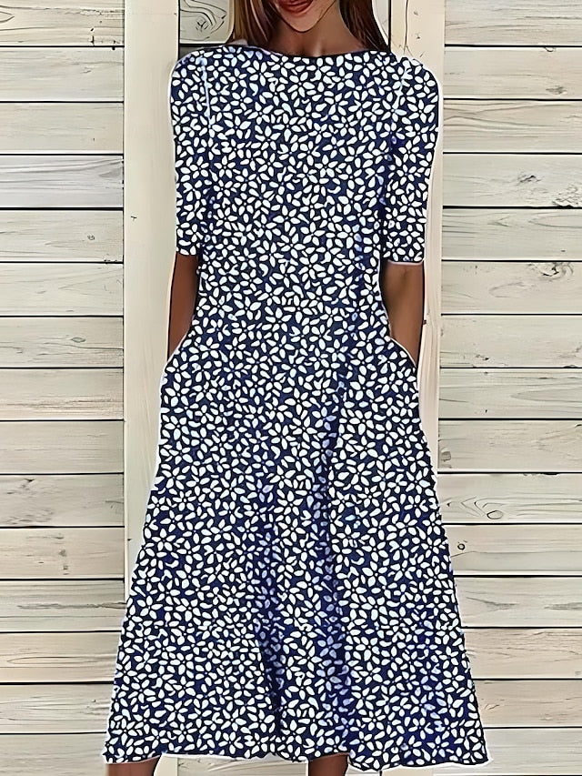 Elegante abito estivo midi floreale da donna, con design costiero, perfetto per un fresco look estivo.